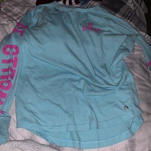 turquoise “be strong” long sleeve tee